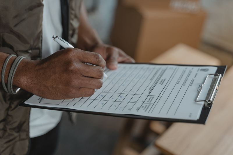 holding a checklist